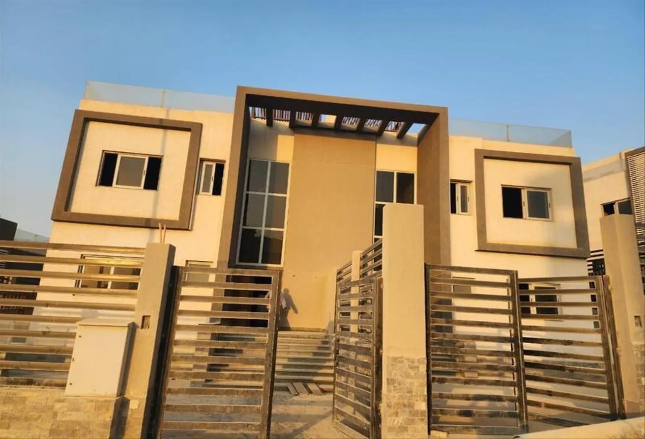 Sale in Al Khamayel city: Twin house in Al Khamayel Compound and 5 year inst