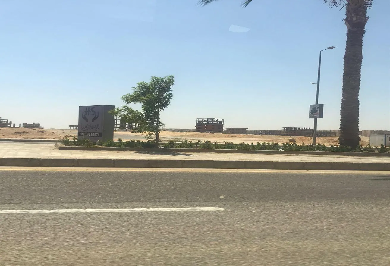 Sale in New October City: أرض للبيع بموقع متميز جداً بشمال المطار بسعر مميز