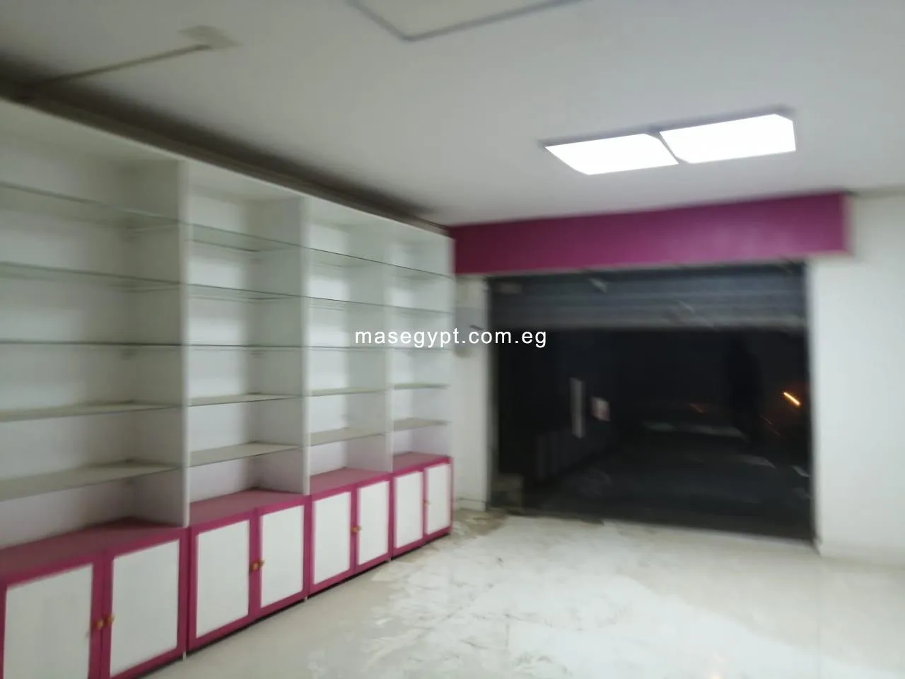 An equipped pharmacy for rent in Mohandeseen, off Ahmed Orabi St.